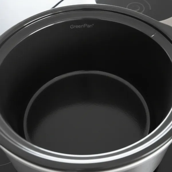 Close-up of a GreenPan slow cooker's Thermolon Volt ceramic non-stick interior, highlighting its smooth surface.